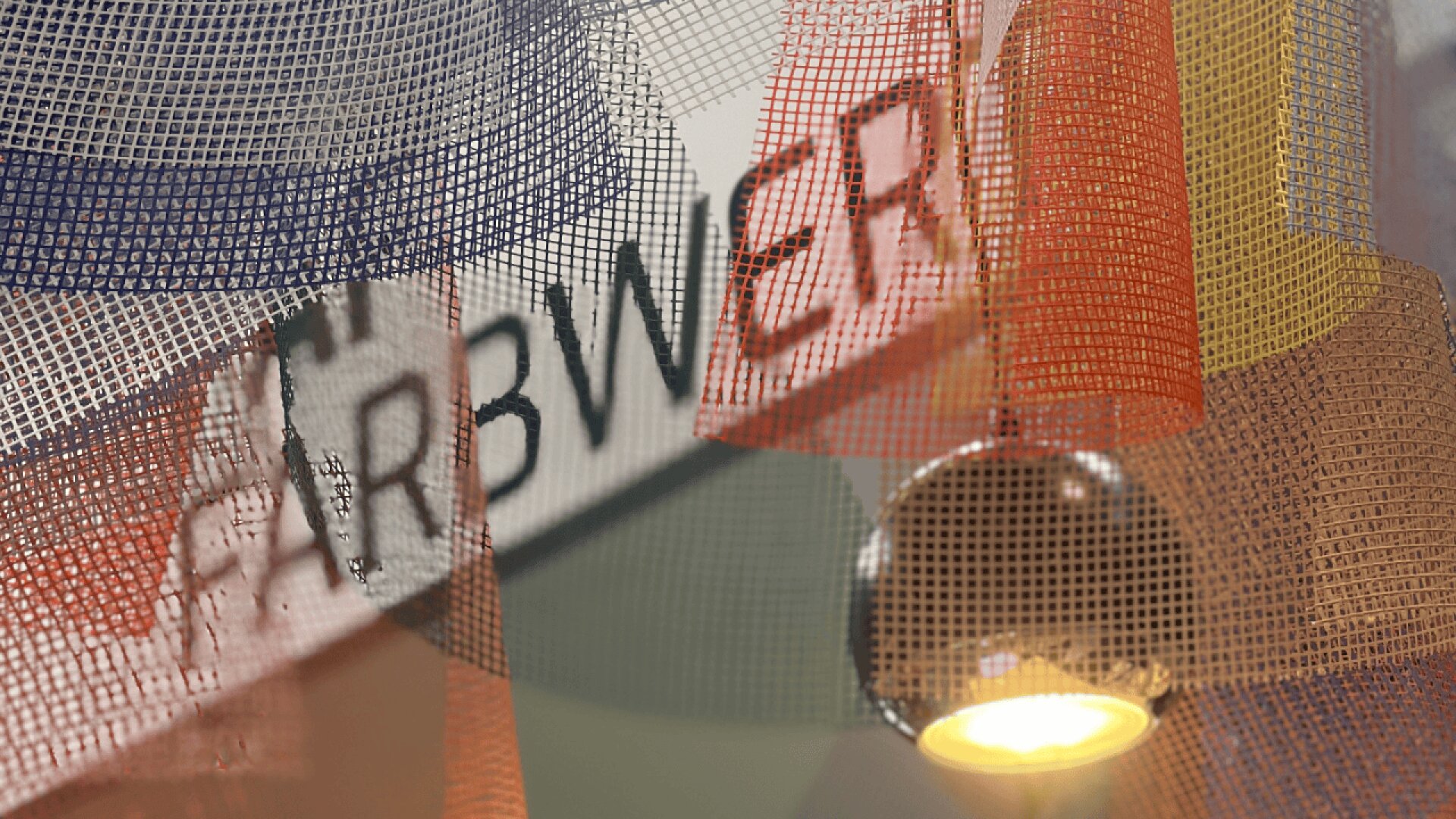 Translucent mesh fabric in blue, orange, yellow, and red hangs in front of a lit, metallic pendant lamp. In the background, part of a sign with the word FARBWERK is visible.