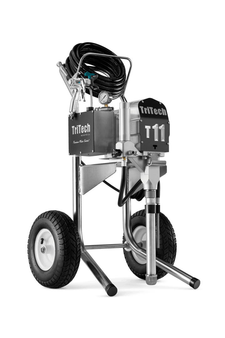 A TriTech T11 professional airless paint sprayer on large wheels, with hoses coiled on top, metallic frame, and visible brand labeling, designed for industrial or commercial painting applications.