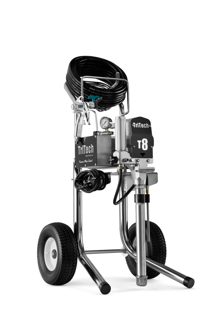 A wheeled airless paint sprayer with a metal frame, hose coiled on top, control panel, pressure gauge, and two large black tires. The device is labeled TriTech T8.