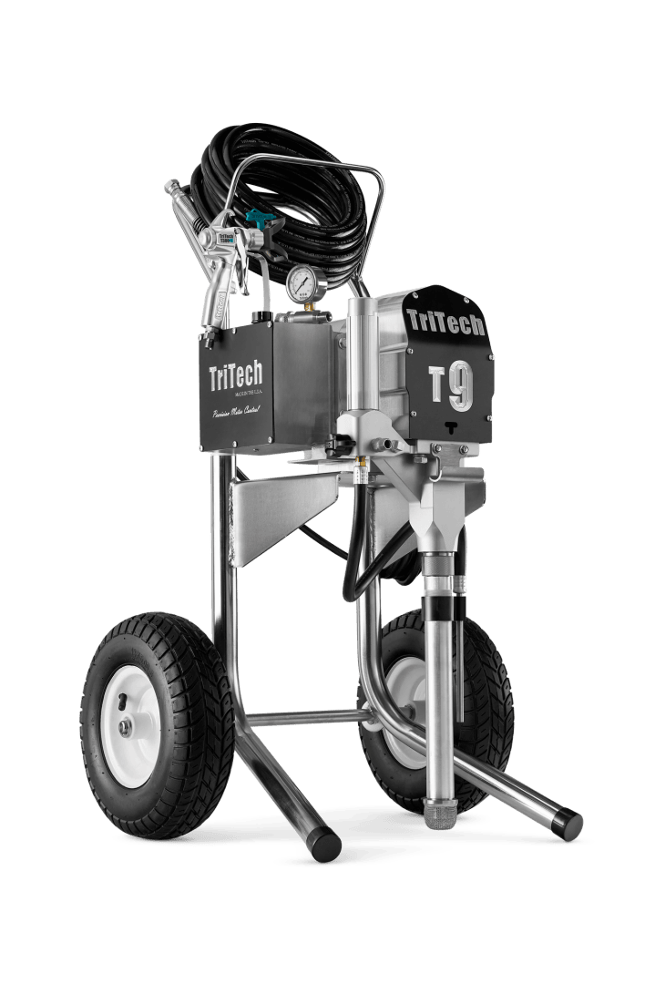 A TriTech T9 airless paint sprayer with large wheels, a metal frame, black hoses coiled on top, and control dials, designed for professional painting applications.