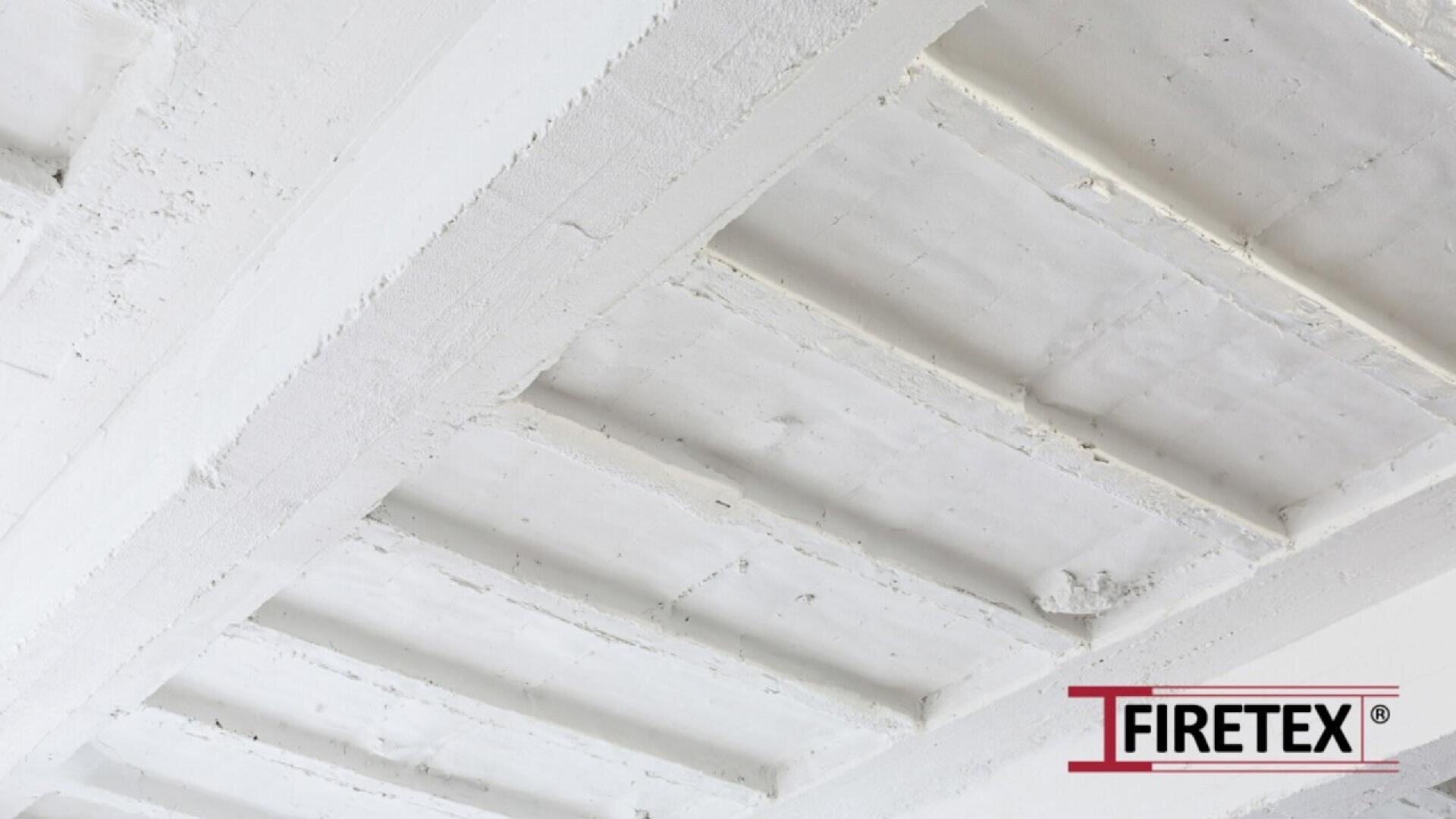 White-painted concrete ceiling beams with visible texture; the FIRETEX® logo appears in the lower right corner.